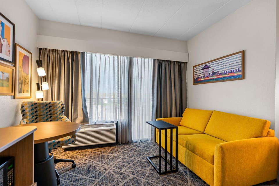 Room, 1 King Bed with Sofa bed | Living area | 32-inch flat-screen TV with cable channels, TV