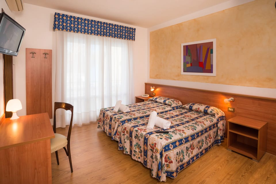 Family Quadruple Room | In-room safe, desk, iron/ironing board, free cribs/infant beds