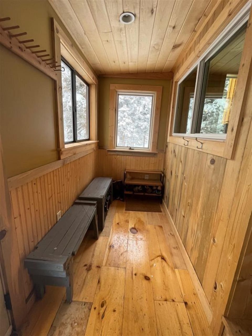 Handy Mud Room Entry for All the Boots and to keep out the SNOW