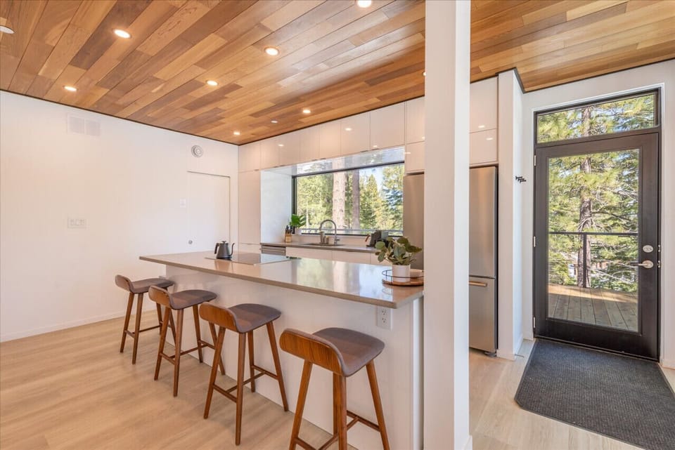 Fully equipped kitchen with large island, 4 stools, and tons of storage.