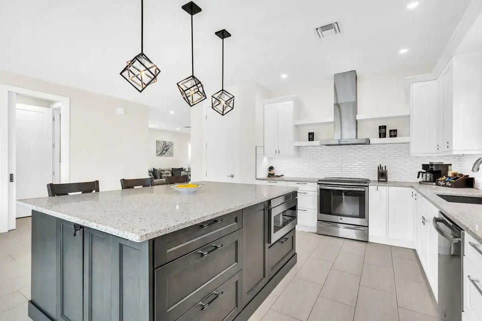 Ample counter space and an oversized kitchen island, a chef's dream!