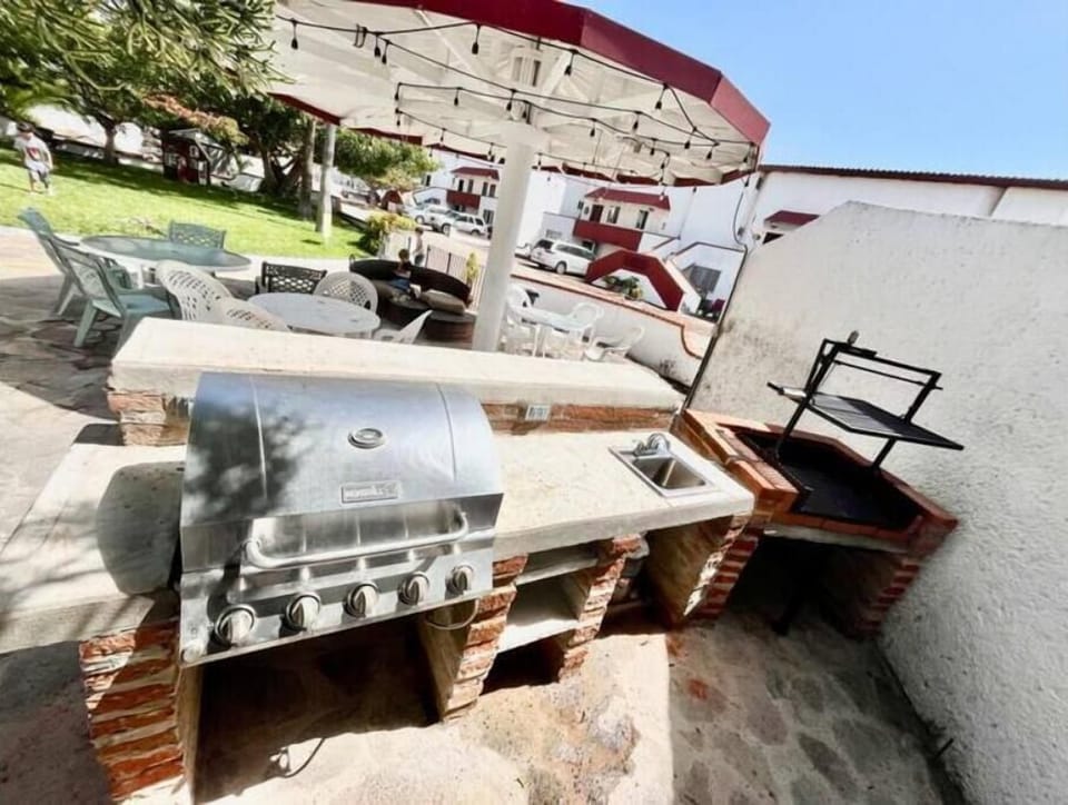 Outdoor Gas & Wood BBQ Grill Area.