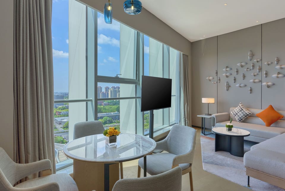Suite, 1 King Bed | Bathroom | Slippers, towels