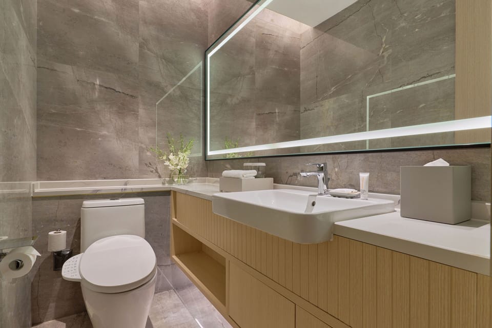 Suite, 1 King Bed | Bathroom | Slippers, towels
