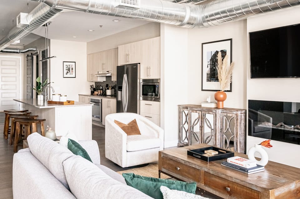 Condo, Multiple Beds, Patio, City View ((R06) 3198 Blake St. Unit 303) | Living area | TV, fireplace