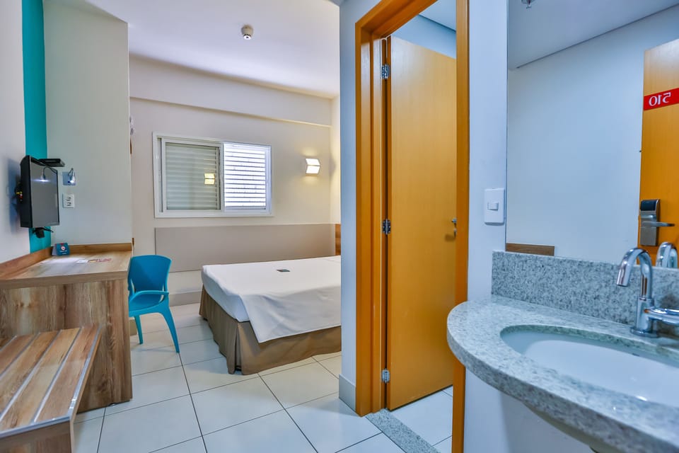 Standard Double Room | Minibar, in-room safe, blackout drapes, iron/ironing board