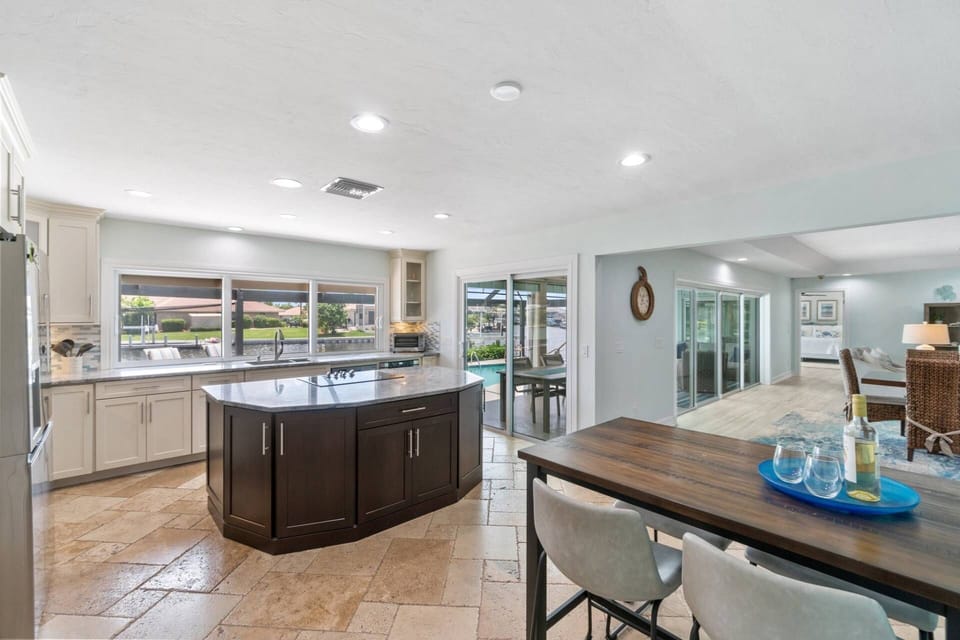 The kitchen opens onto the lanai with a slider door and a pass through window.