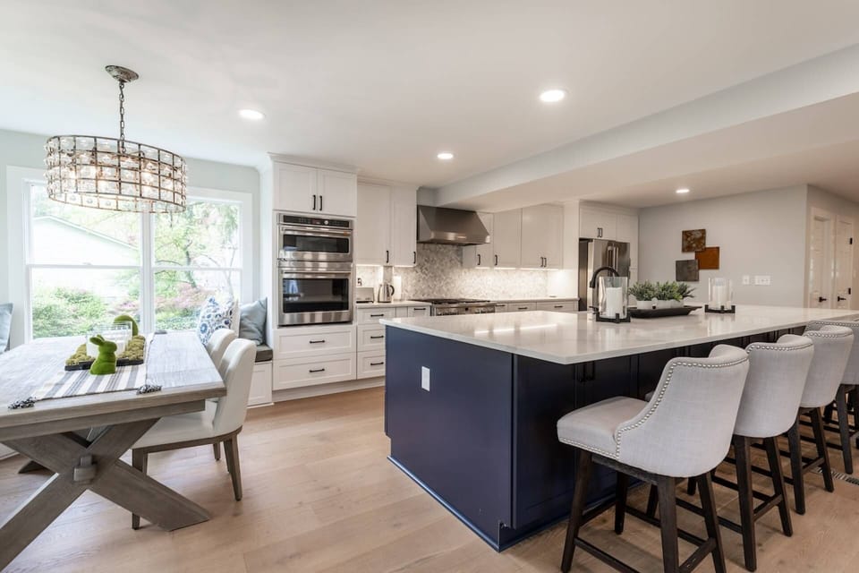 The architectural marvel of the gourmet open kitchen and multi-dining areas on the main floor.