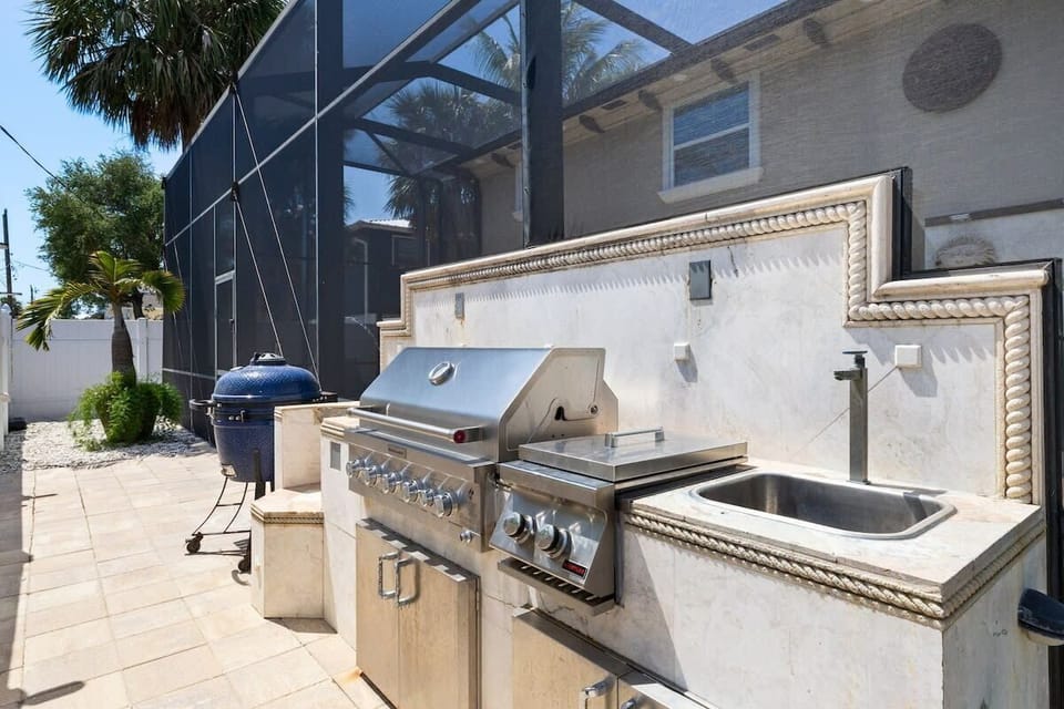 Outdoor grilling area with egg grill and built in propane grill