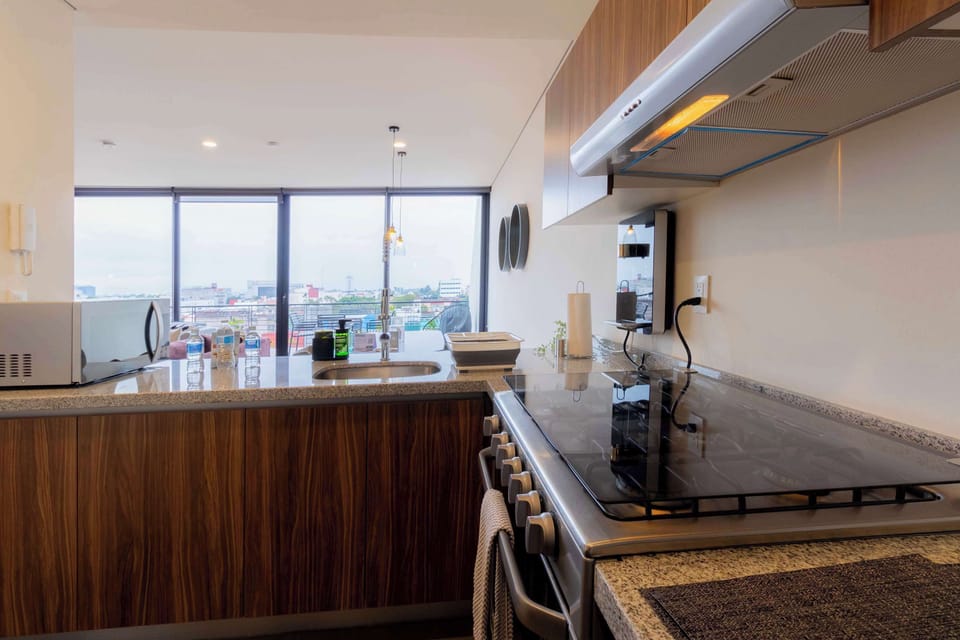 Prepare meals with ease in our stocked kitchen.
