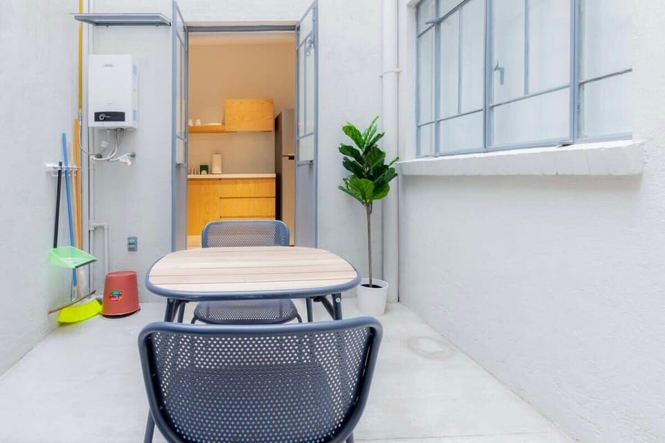 Serene Kitchen Opening to Lush Patio


