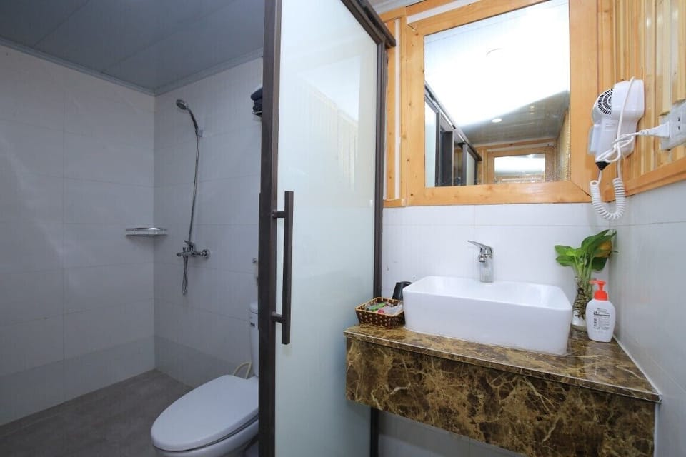 Classic Room, Multiple Beds, Balcony, Mountain View | Bathroom | Shower, free toiletries, hair dryer, slippers