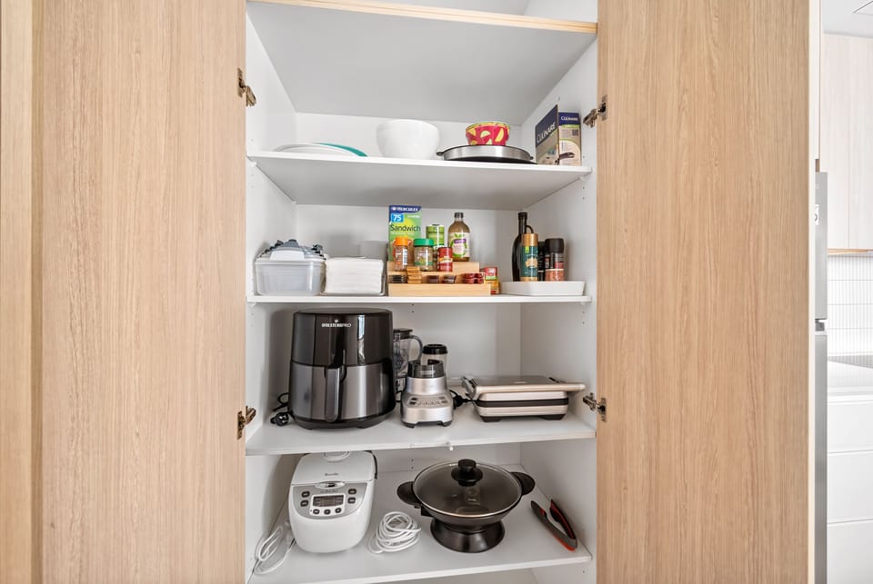Kitchen Pantry is well equipped with condiments, storage containers and quality appliances