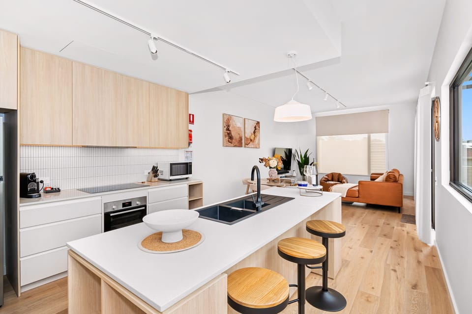 Kitchen has quality amenities, marble breakfast bar
