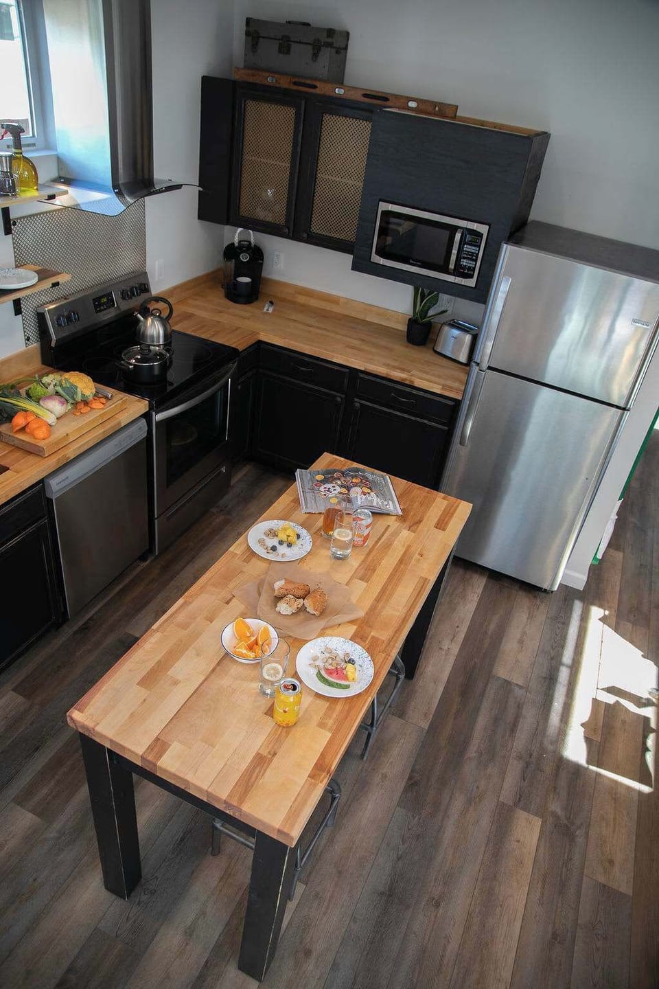 28. A Modern Kitchen with an Island and Well Appointed Amenities
