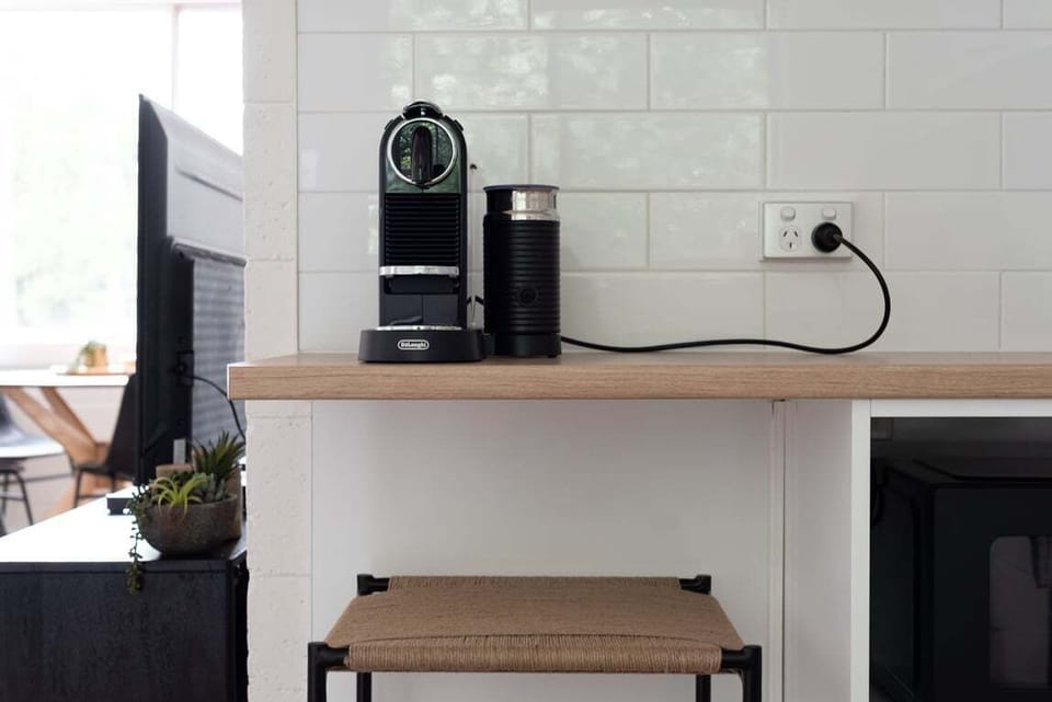 Start your morning right at the coffee station, featuring a premium espresso machine and milk frother.