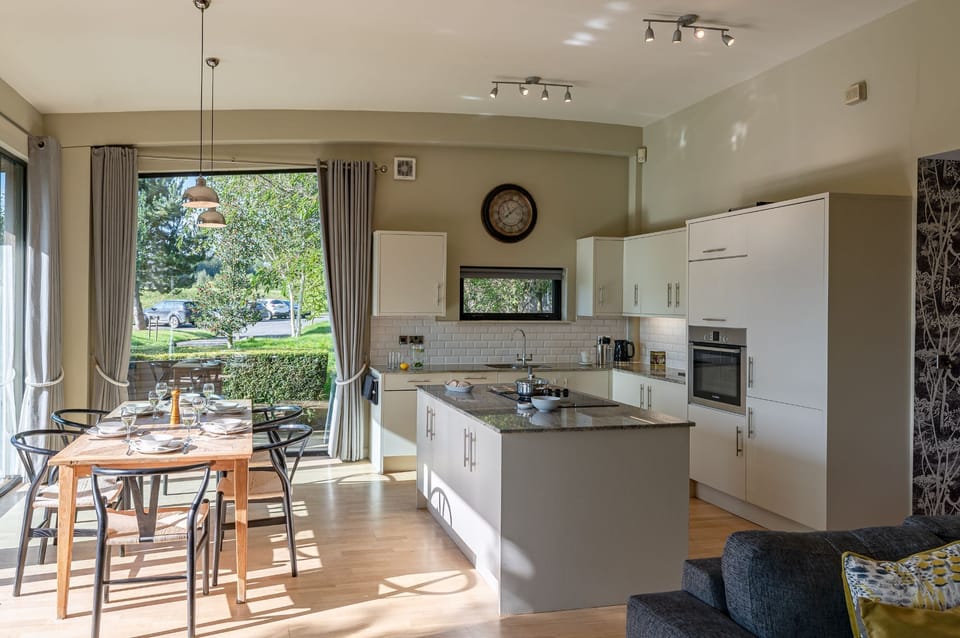 Open-plan kitchen and dining space at Percy lodge, Brompton Lakes.