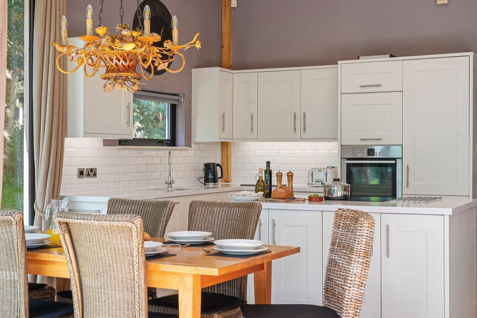 Dining space and modern kitchen in Jules lodge, Brompton Lakes.