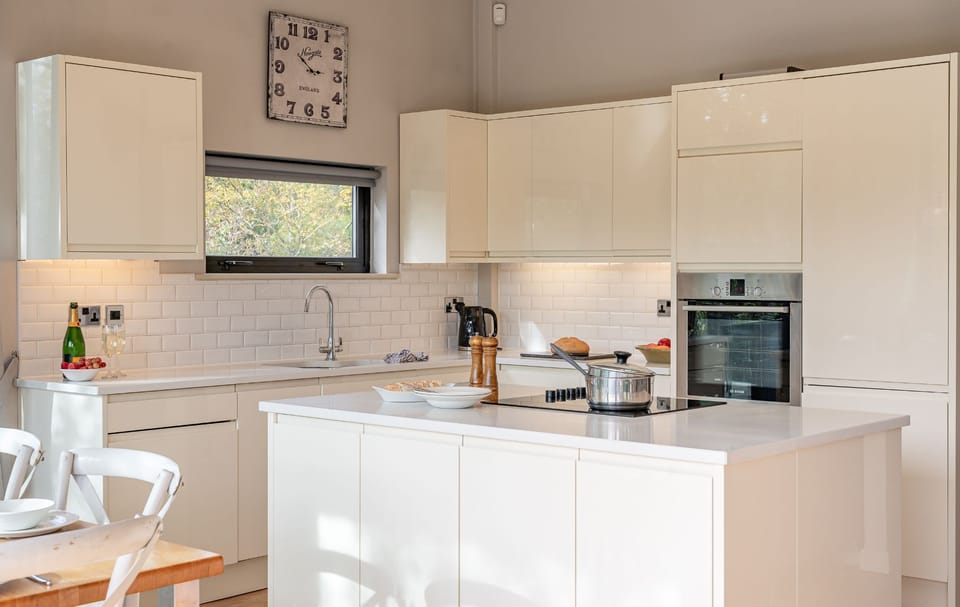 Modern kitchen with island and appliances in Finley lodge at Brompton Lakes.