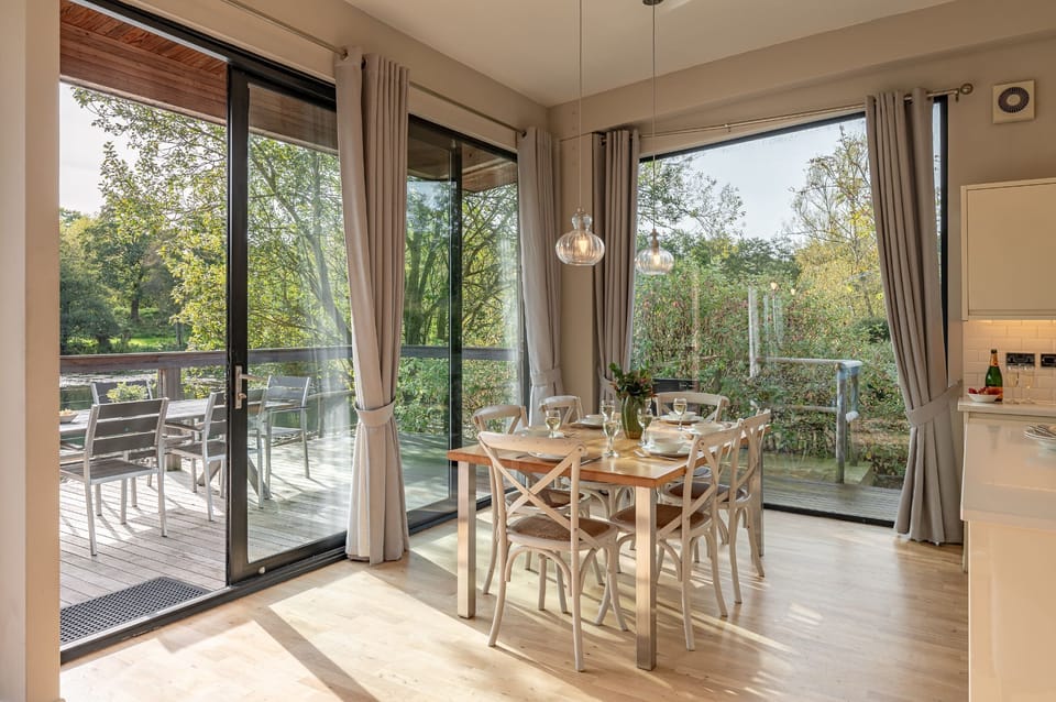 Dining area and lake views in Finley lodge, Brompton Lakes.