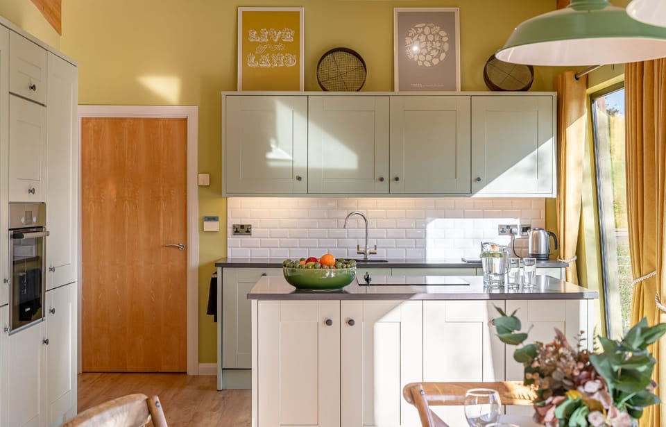 Modern kitchen interior in Florence lodge at Brompton Lakes with stylish furnishings and natural light.