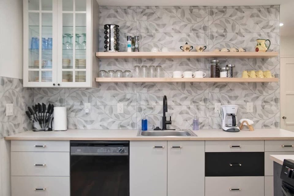 Cook up your favorites with our complete kitchen setup—featuring cookware, dishes, coffee maker, toaster, stove, oven, microwave, refrigerator, and more!