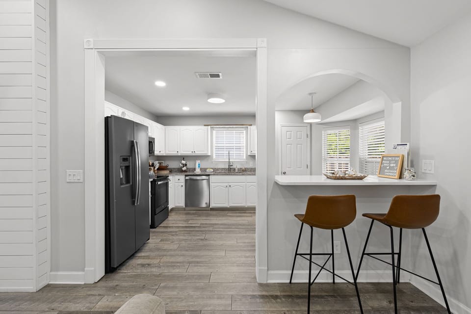 Bright, airy kitchen with modern appliances and a breakfast bar where you can enjoy your morning coffee in style.