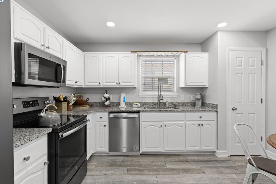 Your fully equipped kitchen features granite counters, stainless appliances, and everything you need to prepare meals during your stay.
