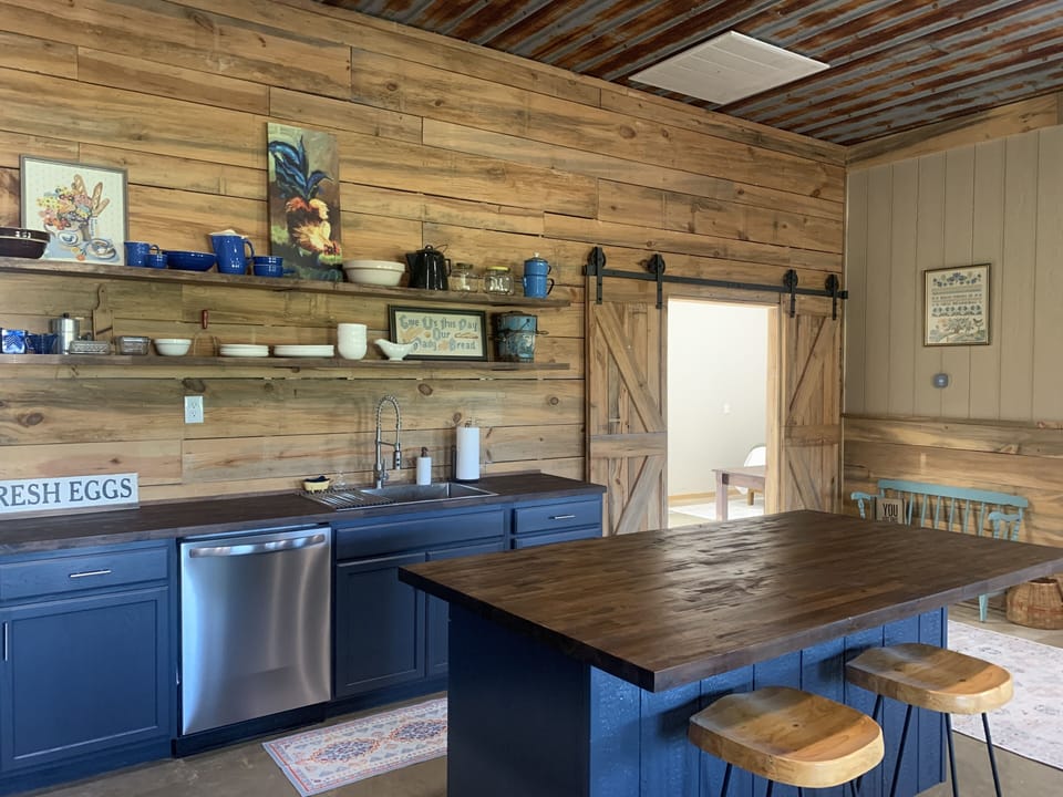 Kitchen and access to master bedroom.