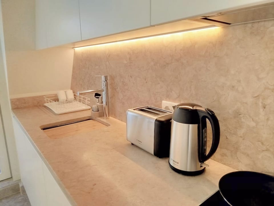 Espresso maker, mini-fridge, microwave, oven