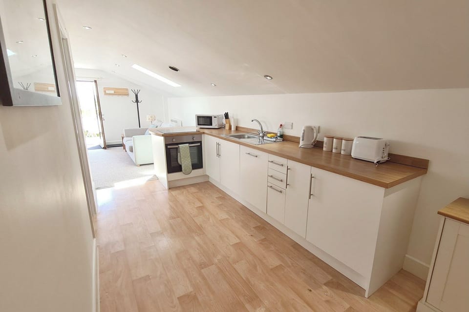 Kitchen area | Stable Barn Apartment - Hallagenna Farm Properties, Bodmin Moor