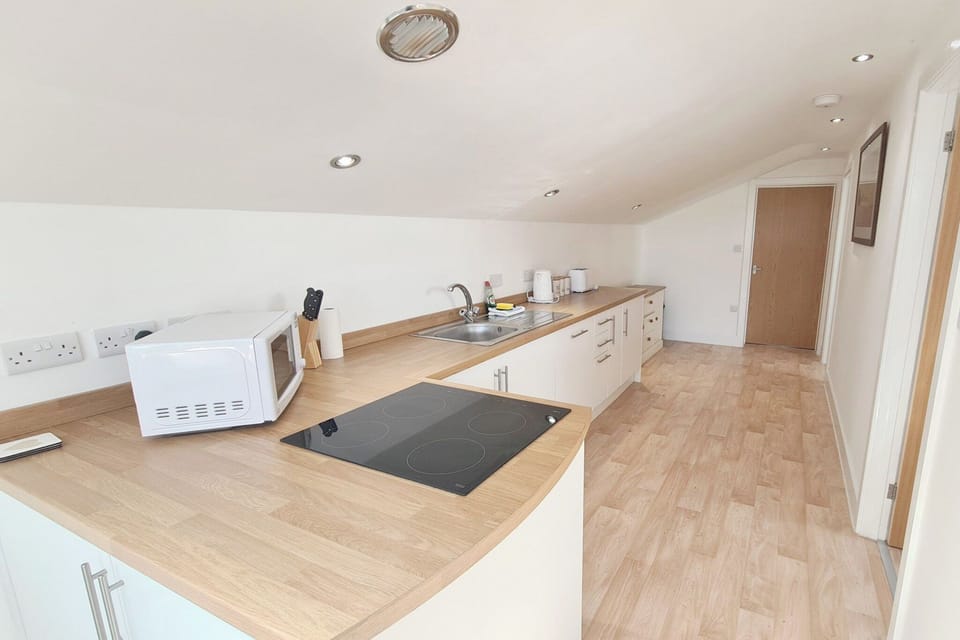 Kitchen area | Stable Barn Apartment - Hallagenna Farm Properties, Bodmin Moor