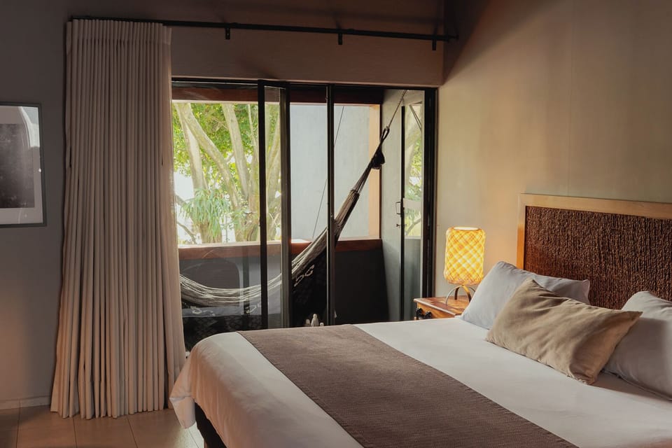 Design Suite, 1 King Bed, Balcony | Minibar, in-room safe, individually decorated, desk