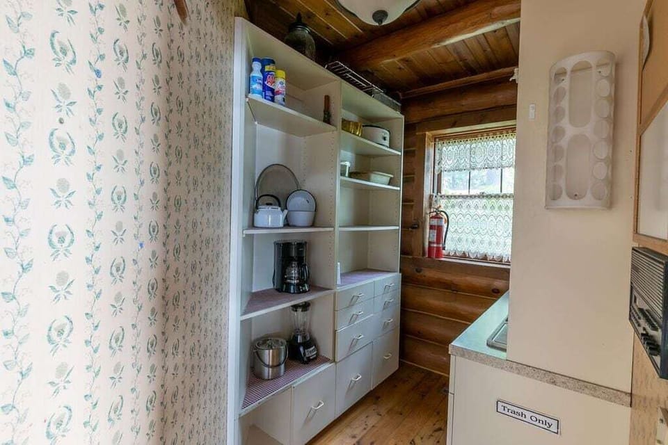Pantry with more pans and dishware.  Even an intercom system to call guests for dinner.
