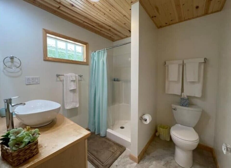 Bathroom 1 offers a shower with shampoo, conditioner, body wash, and hand soap.