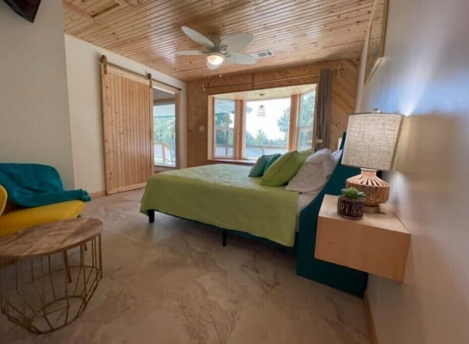 Bedroom 1 offers a TV, full bed, ensuite bathroom and bay window reading nook.