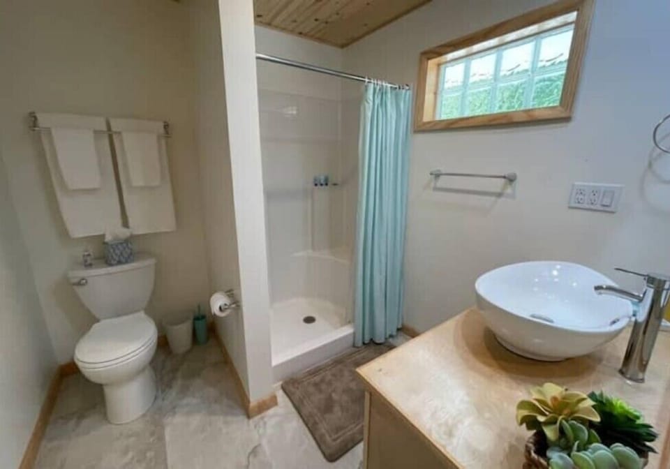 Bathroom 2 offers a shower with shampoo, conditioner, body wash, and hand soap.