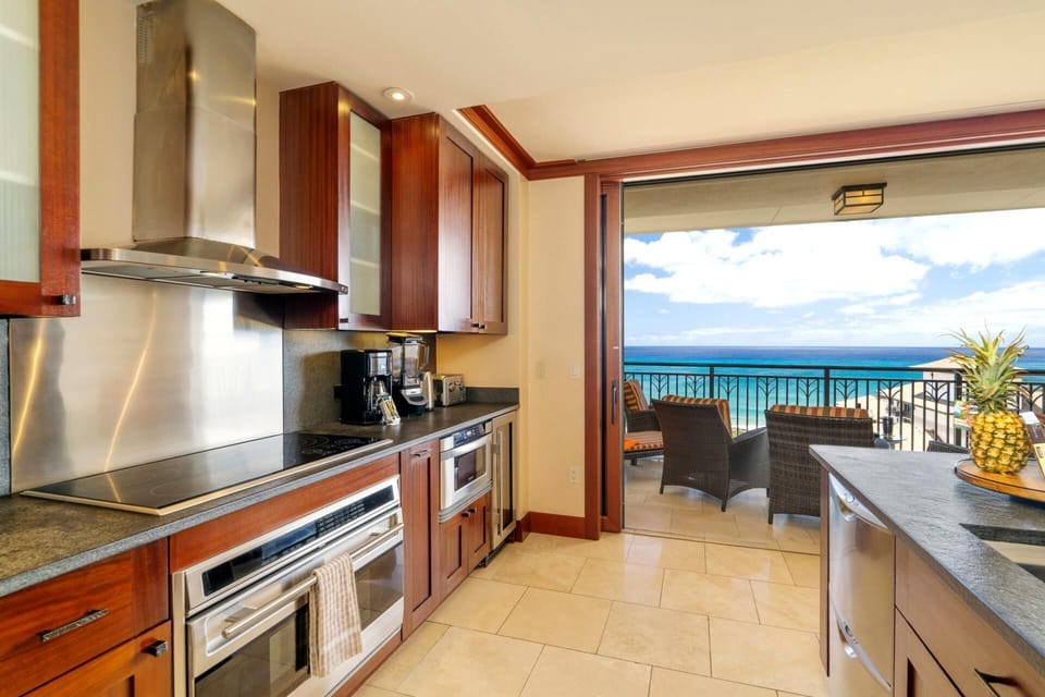     This kitchen glistens like a gourmet treasure chest, with stainless steel shining brighter than a polished pearl