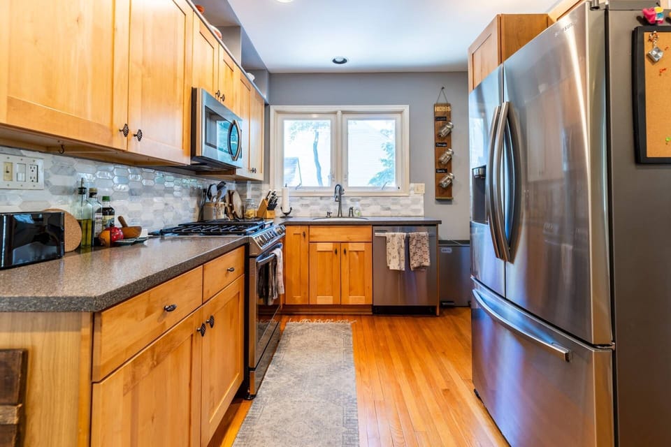 The kitchen has been updated with all stainless steel appliances.