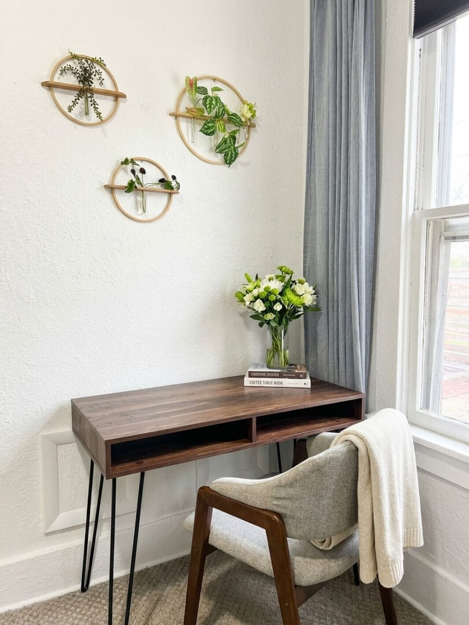 Bedroom 2: Dedicated writing desk with chair and botanical wall art -- perfect for remote work