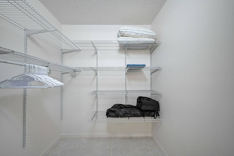 Unpack and unwind — our walk-in closet gives your wardrobe room to breathe.