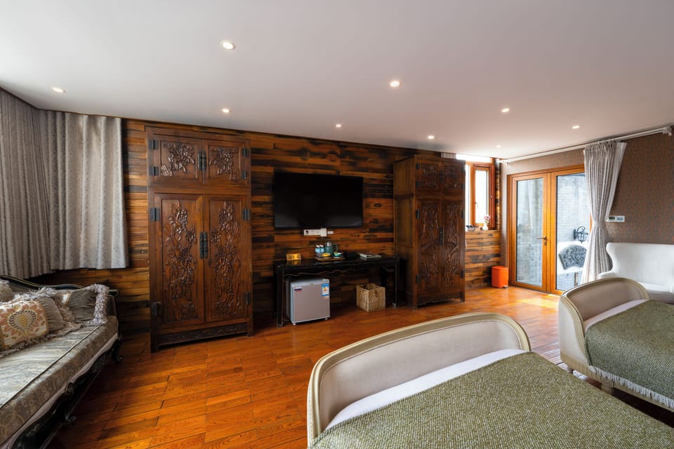 Signature Triple Room, Multiple Beds, Courtyard View, Ground Floor | Living area | LCD TV, heated floors