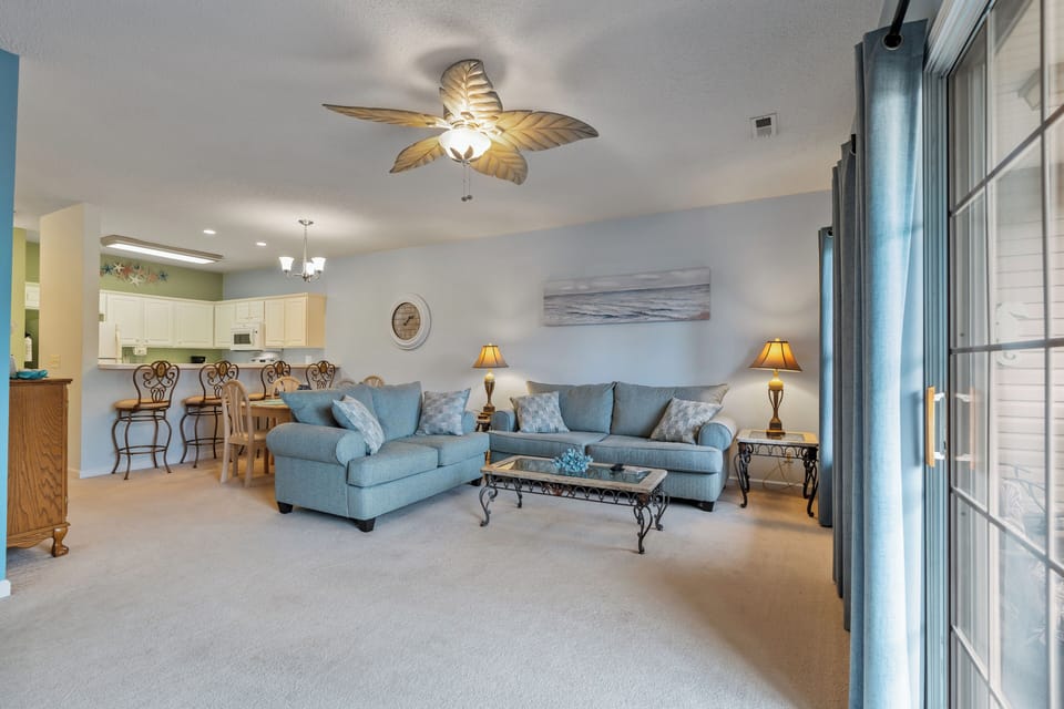The private balcony off the main living room invites you to step outdoors.