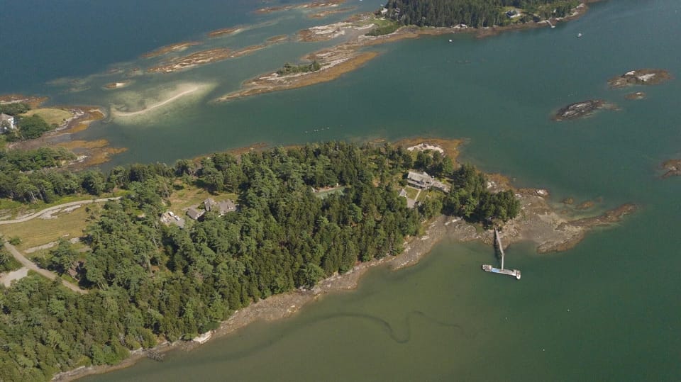 The Compound -The Maine House on the right, the Tennis Court in the middle, The Owner's residence on the left.