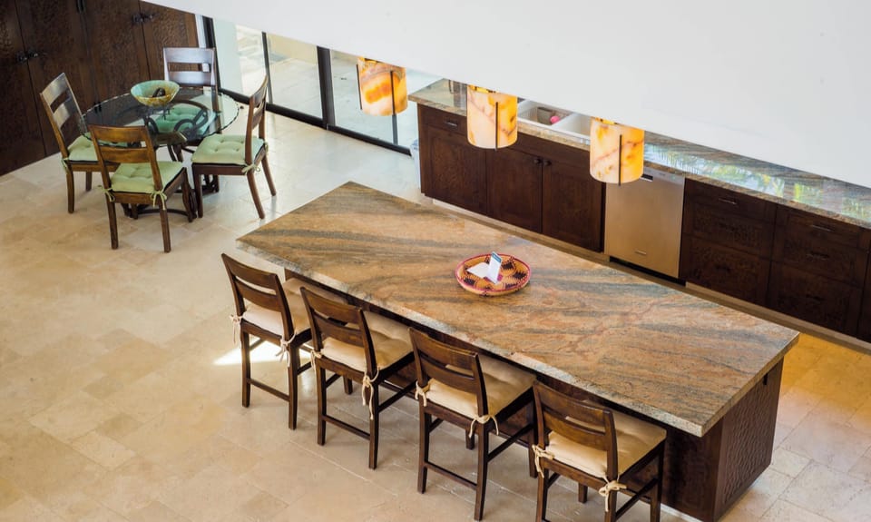 The kitchen island has 4 chairs, great for a quick snack