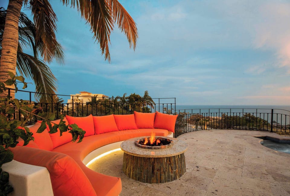 Gather around the cushioned firepit lounge at sundown