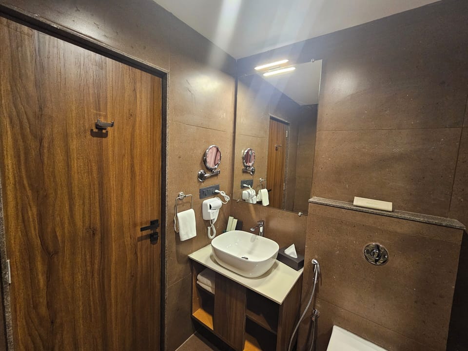 Winter Green Cottage | Bathroom | Shower, hair dryer, slippers, towels