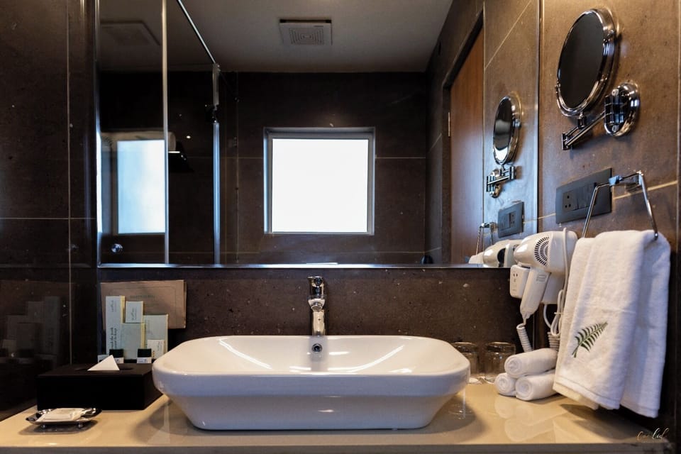 Shower, hair dryer, slippers, towels