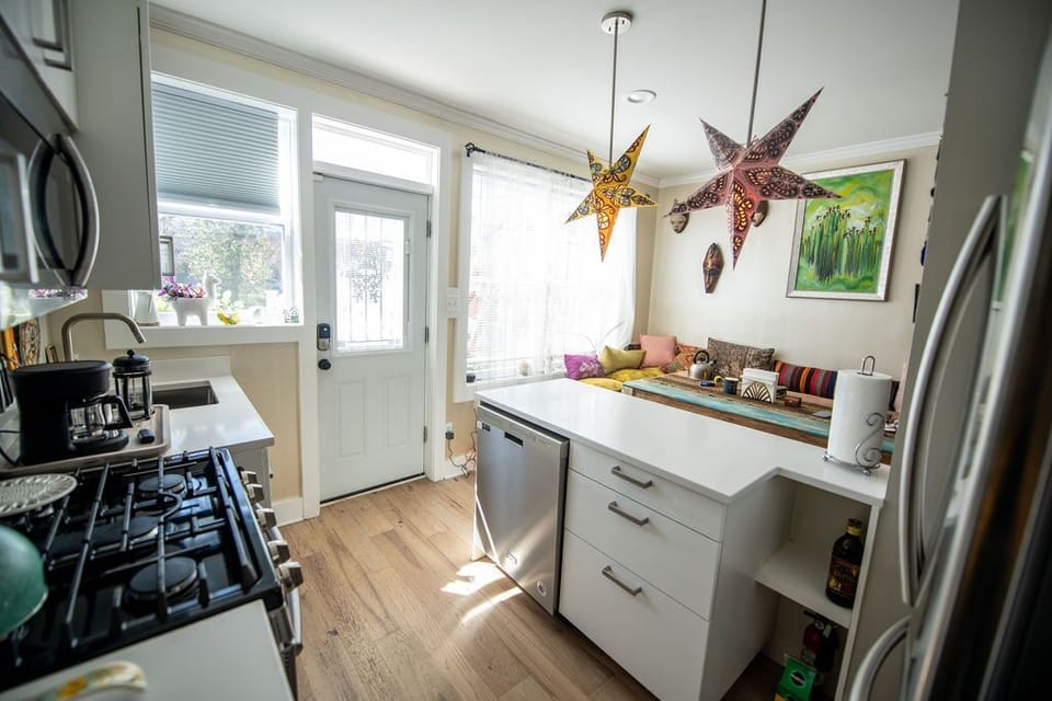Fully equipped kitchen with gas range.