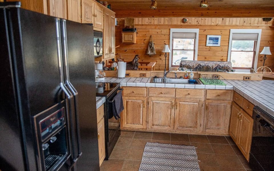 Modern appliances, expansive counterspace and  complete dinnerware.